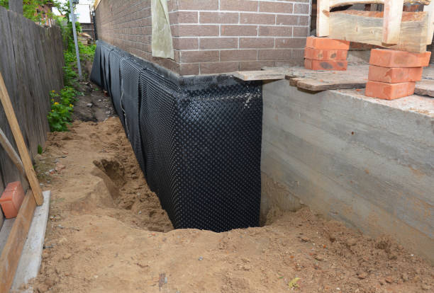 Happy homeowners after waterproofing job in Fairless Hills